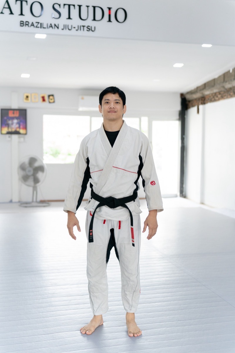 Head coach Nattakorn Mahittharithikrai in his black belt on the mats at Gato Studio BJJ in Chiang Mai